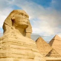 Famouse Sphinx and the great pyramids under interesting evening clouds, Cairo, Egypt
